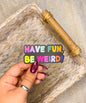 Have Fun, Be Weird! Vinyl sticker, 3x1.5 in.